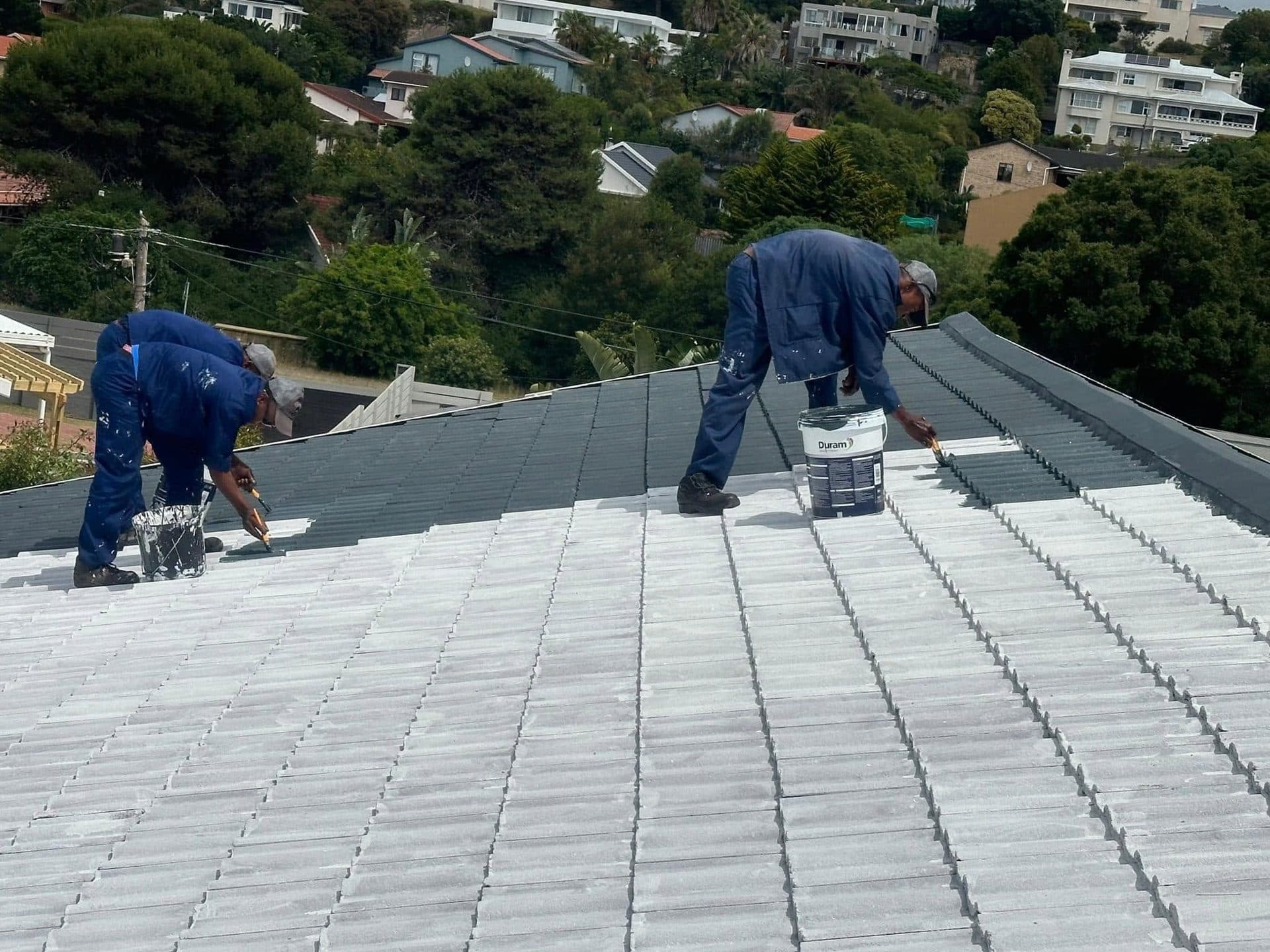 The Roof Doctor team priming a tile roof